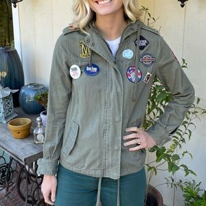 Army jacket with pins and patches